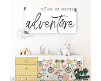 a white dresser with a sign above it that says, you are our greatest adventure