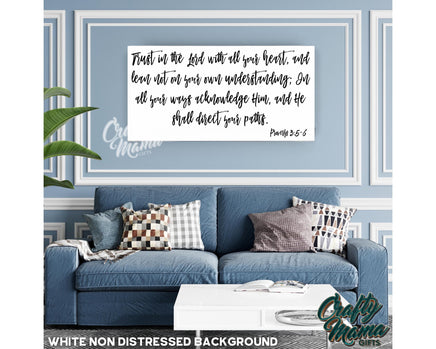 a living room with a blue couch and a quote on the wall