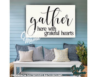 a bench with pillows and a sign that says gather here with grateful hearts