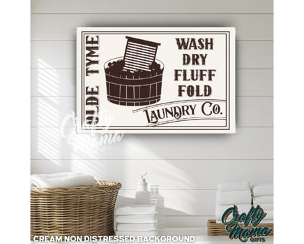 a laundry sign hanging on the wall of a bathroom