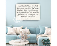 a living room with a blue couch and a quote on the wall