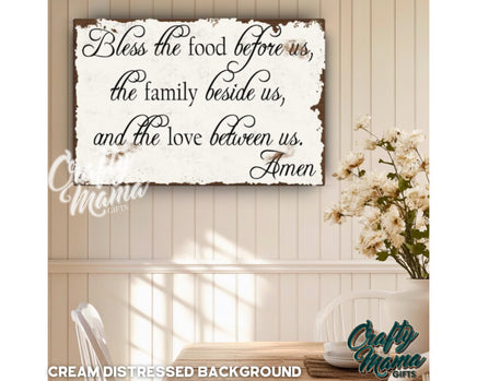 a wooden sign that says, bless the food before us, the family beside us