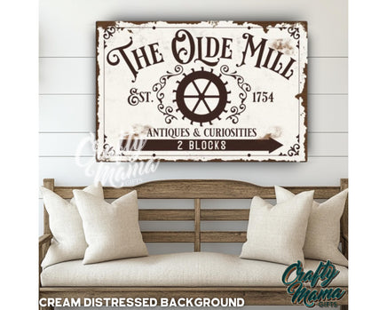 a wooden sign that says the old mill