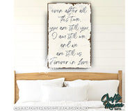 a bedroom with a bed and a picture on the wall