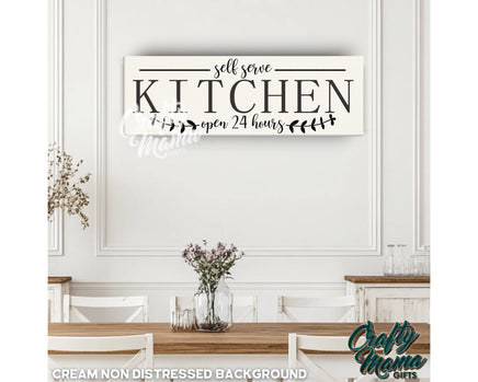 a kitchen sign hanging on the wall above a table