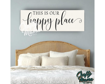 a bedroom with a bed and a sign that says, this is our happy place