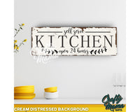 a kitchen sign on a white wall with yellow dishes