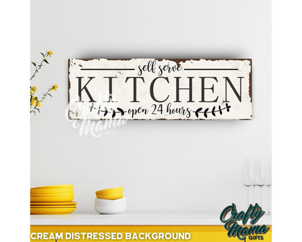 a kitchen sign on a white wall with yellow dishes