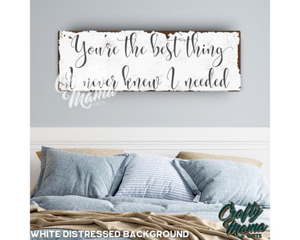 a bed with a wooden sign above it that says you&#39;re the best thing