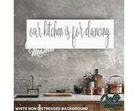 a kitchen with a sign that says our kitchen is for dancing