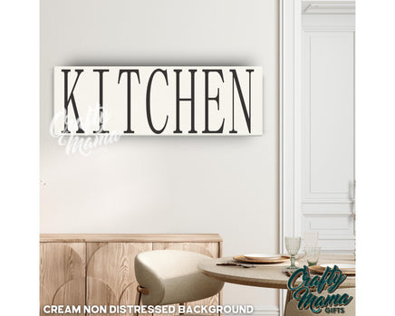 a kitchen sign hanging on the wall above a table