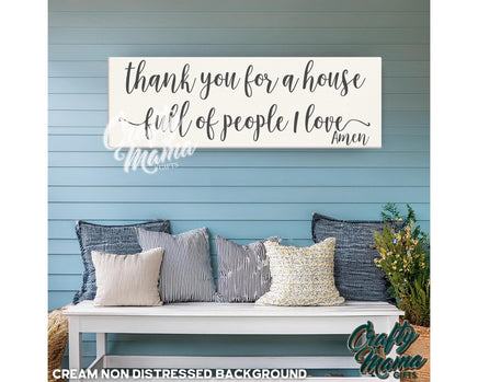 a bench with pillows and a sign that says thank you for a house full of