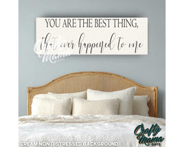 a bed with pillows and a sign above it that says you are the best thing