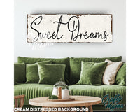 a living room filled with furniture and a sign that says sweet dreams