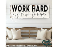 a wooden sign that says work hard and be nice to people