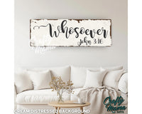 a wooden sign that says, whoser, on a wall above a table with